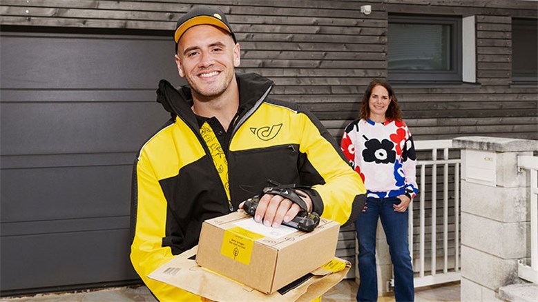 Delivery person with parcels and customer